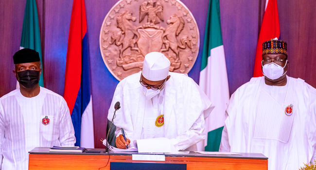 President Buhari Signs 2021 Budget, Finance Bill Into Law