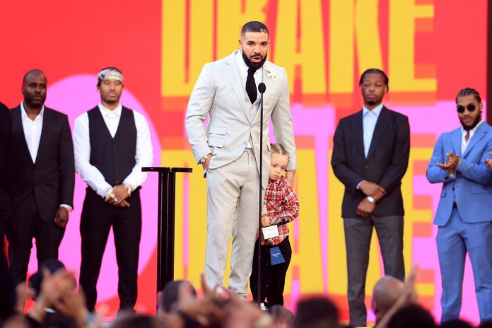 Drake Accepts Artist Of The Decade Award With Son Adonis At 2021 Billboard Music Awards